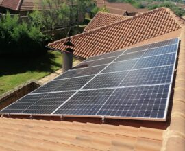 Solar panels on a red tile roof