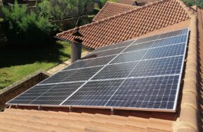 Solar panels on a red tile roof