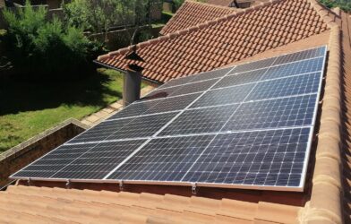 Solar panels on a red tile roof