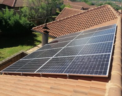Solar panels on a red tile roof