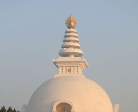 The Vishwa Shanti Stupa captures the serene beauty of sunrise with its iconic architecture.