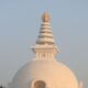 The Vishwa Shanti Stupa captures the serene beauty of sunrise with its iconic architecture.