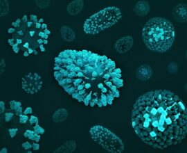 a group of blue and green cells on a black surface