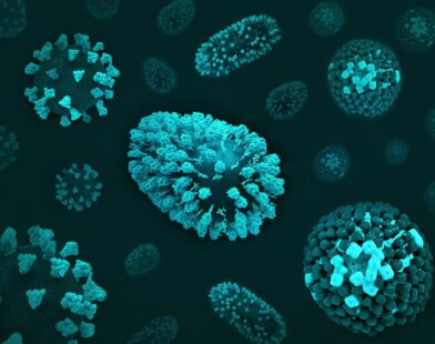 a group of blue and green cells on a black surface