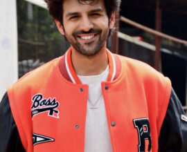 Actor Kartik Aaryan posing during a film production event