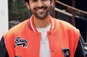Actor Kartik Aaryan posing during a film production event