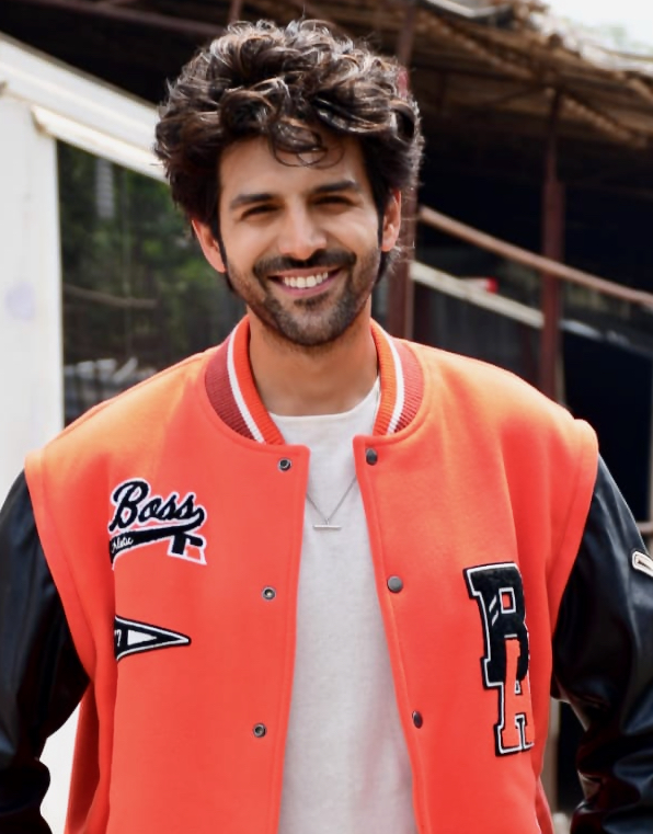 Actor Kartik Aaryan posing during a film production event