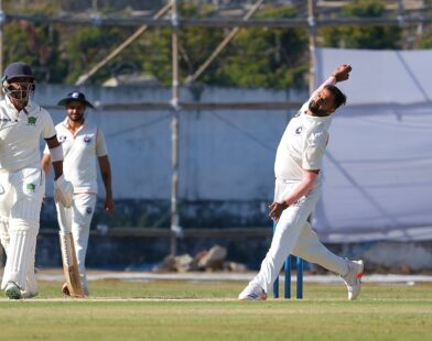 Auqib Nabi bowling for India during a cricket match