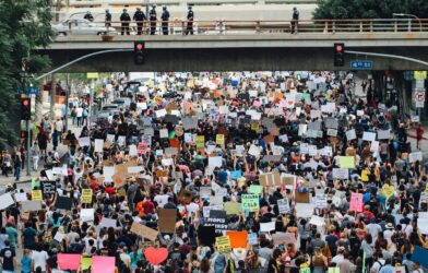 a large group of people holding up signs