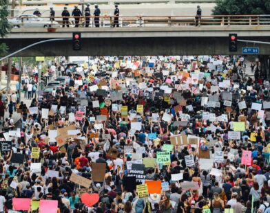 a large group of people holding up signs