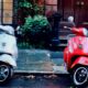 white and red motor scooters parked side-by-side