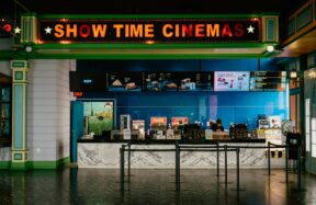 The cinema has a bright "show time" sign