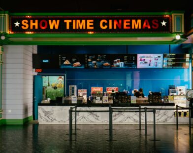 The cinema has a bright "show time" sign