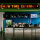 The cinema has a bright "show time" sign