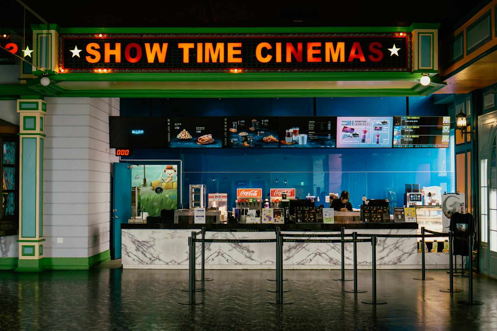 The cinema has a bright "show time" sign