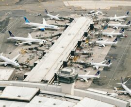 white and gray airplane on airport during daytime