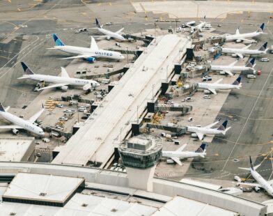 white and gray airplane on airport during daytime