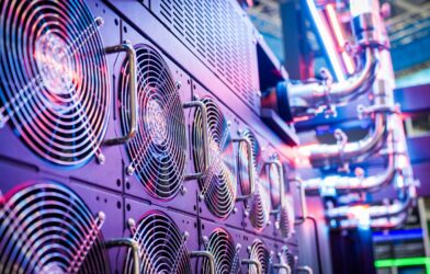 Close-up of server cooling fans in a vibrant data center