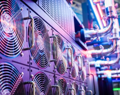 Close-up of server cooling fans in a vibrant data center