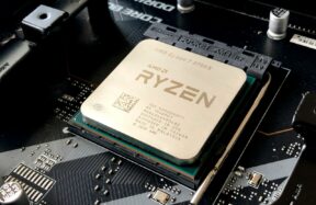 A computer processor installed in a motherboard socket with visible text and circuitry