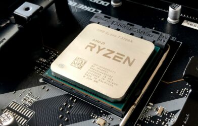 A computer processor installed in a motherboard socket with visible text and circuitry