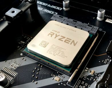 A computer processor installed in a motherboard socket with visible text and circuitry