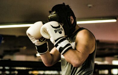a man wearing a white and black boxing glove