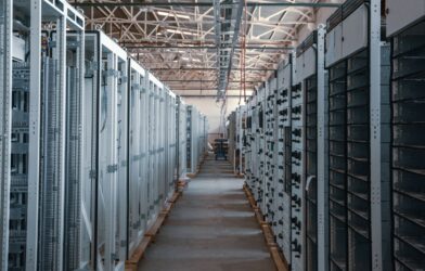 server room aisle with metal equipment racks