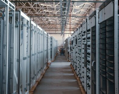 server room aisle with metal equipment racks