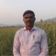शुगर गेज ज्वारीच्या शेतात उभे असलेले शेतकरी पृथ्वीराज चव्हाण