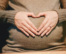 person holding belly photo