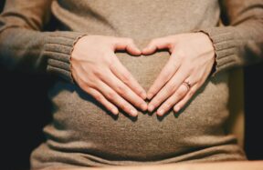 person holding belly photo