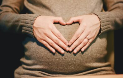 person holding belly photo