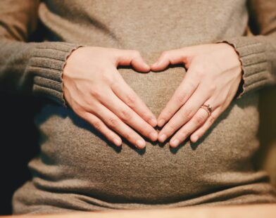 person holding belly photo