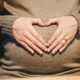 person holding belly photo