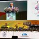 एक आधुनिक सभागार में आयोजित हो रही उच्च स्तरीय बैठक और सम्मेलन का दृश्य