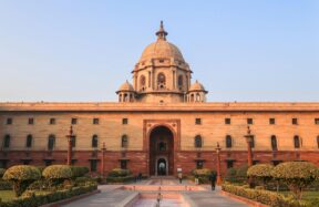beige concrete building under blue sky during daytime