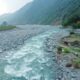river between green trees and mountains during daytime