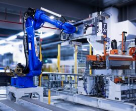blue industrial robot arm in factory