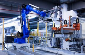 blue industrial robot arm in factory
