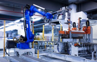 blue industrial robot arm in factory