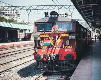 red train on a station platform