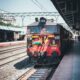 red train on a station platform