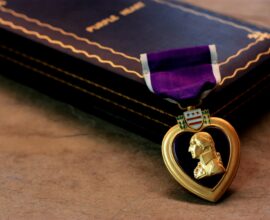 a wallet with a purple cloth and a purple wallet